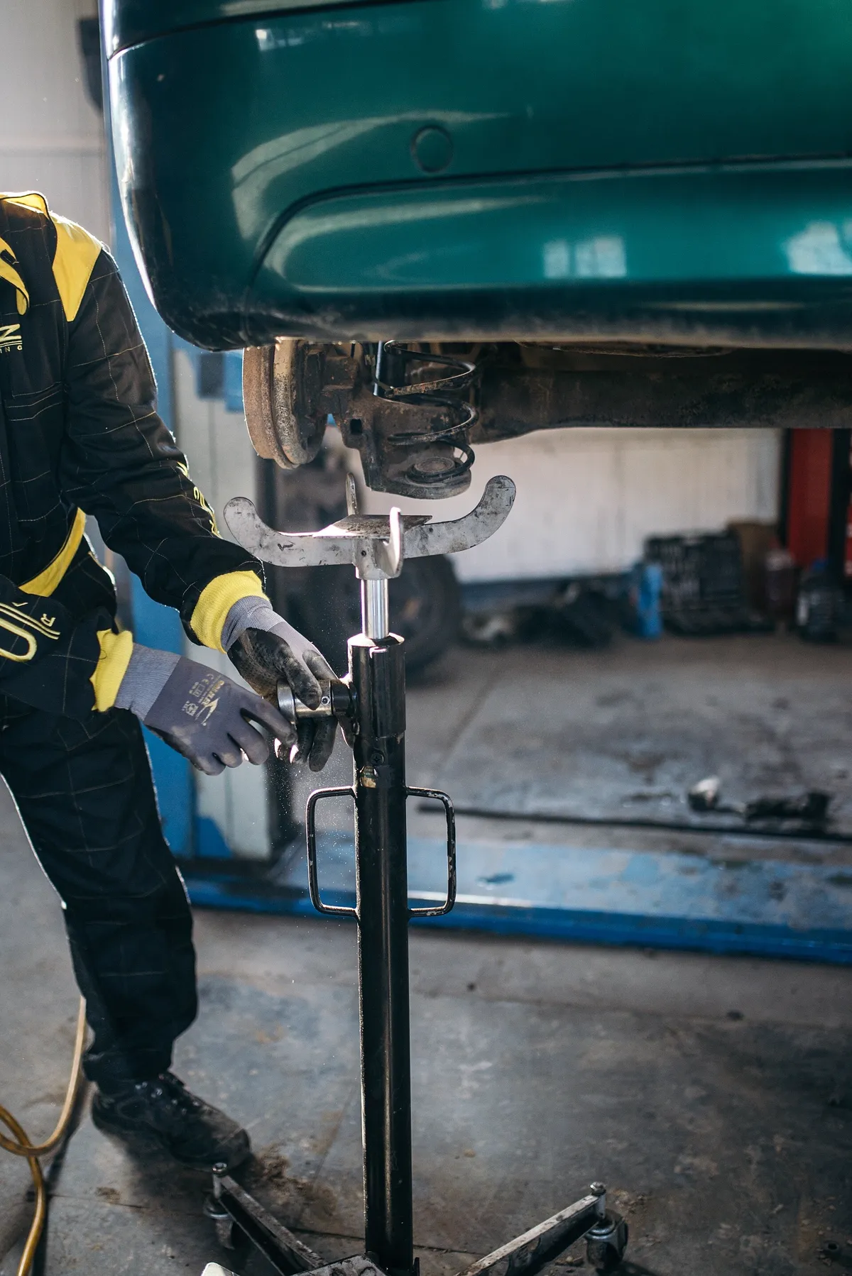 Mechanic working under a car