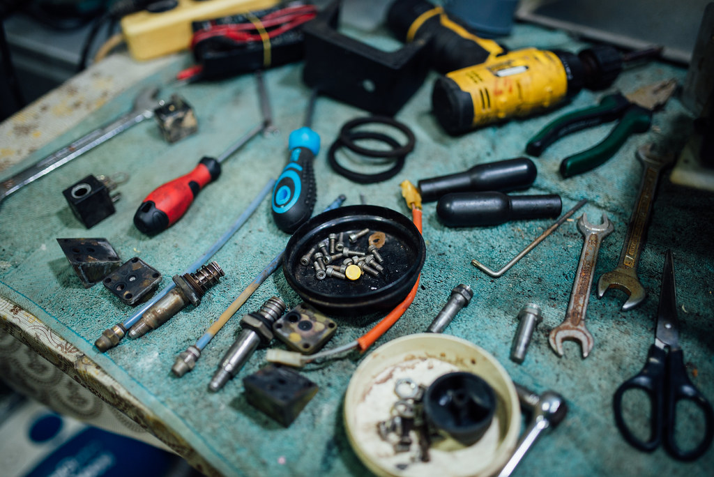 Tools and parts on a shop workbench
